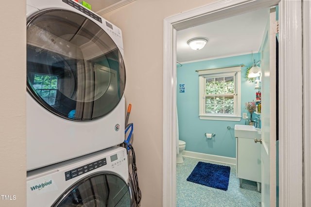 1905 Bivins St, Durham, NC 27707 - laundry area with estacked washer and dryer, ornamental molding, and baseboards