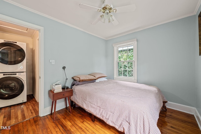 1905 Bivins St, Durham, NC 27707 - bedroom with estacked washer and dryer, wood-type flooring, baseboards, crown molding, and a ceiling fan