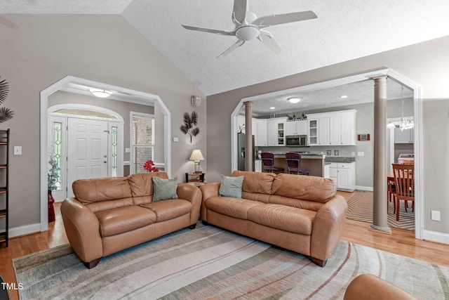1016 Luminary Ln, Willow Springs, NC 27592 - living room with decorative columns, light wood-style floors, lofted ceiling, a ceiling fan, and baseboards