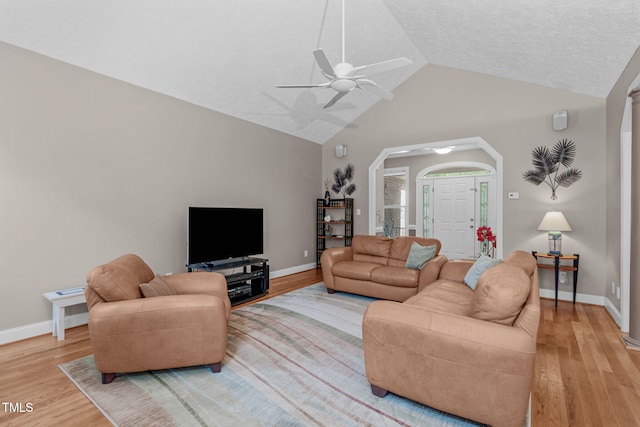 1016 Luminary Ln, Willow Springs, NC 27592 - living room with light wood finished floors, vaulted ceiling, a ceiling fan, and baseboards