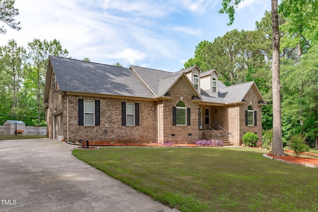 1016 Luminary Ln, Willow Springs, NC 27592 - view of front facade with a shingled roof, brick siding, crawl space, and a garage