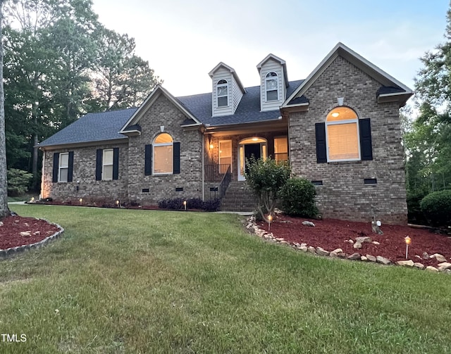 1016 Luminary Ln, Willow Springs, NC 27592 - view of front facade featuring crawl space, a front lawn, brick siding, and roof with shingles