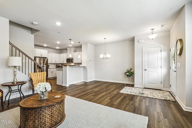 433 Parker Station Ave, Fuquay Varina, NC 27526 - living room featuring dark wood finished floors, a chandelier, baseboards, recessed lighting, and stairway