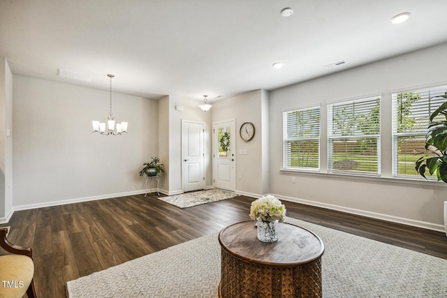 433 Parker Station Ave, Fuquay Varina, NC 27526 - entrance foyer featuring wood finished floors, a chandelier, baseboards, and recessed lighting