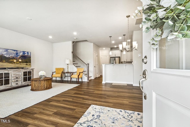 433 Parker Station Ave, Fuquay Varina, NC 27526 - foyer entrance featuring dark wood-type flooring, stairway, recessed lighting, and a chandelier
