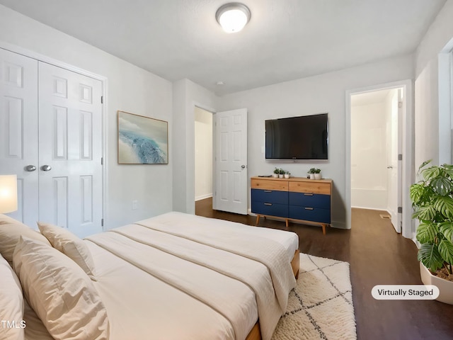 216 E Hinton St, Clayton, NC 27520 - bedroom featuring dark wood finished floors, baseboards, a closet, and connected bathroom