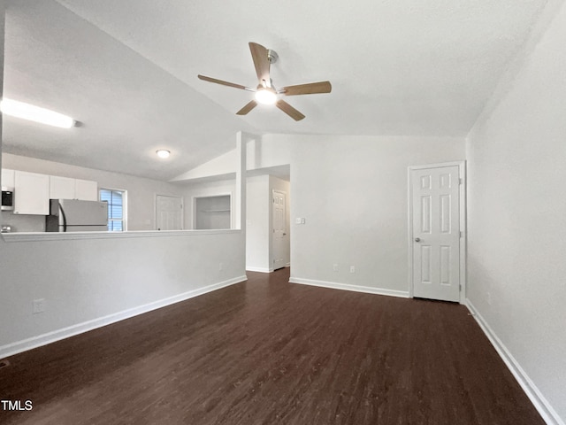 216 E Hinton St, Clayton, NC 27520 - unfurnished living room with ceiling fan, dark wood finished floors, lofted ceiling, and baseboards