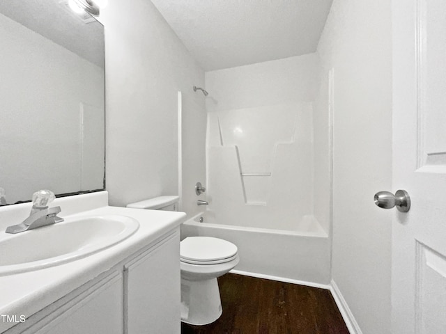 216 E Hinton St, Clayton, NC 27520 - bathroom featuring wood finished floors, toilet, vanity, and bathing tub / shower combination