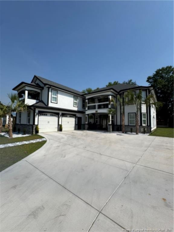 504 E Edinborough Ave, Raeford, NC 28376 - view of front facade featuring an attached garage and concrete driveway