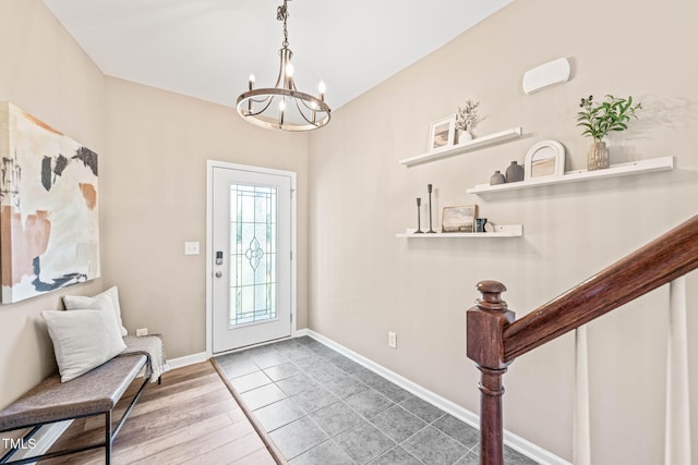 1717 Ormond Rd, Hurdle Mills, NC 27541 - entrance foyer featuring a chandelier, baseboards, and wood finished floors