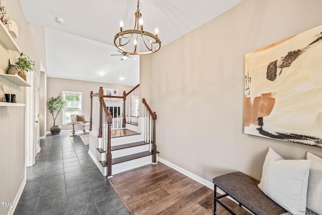 1717 Ormond Rd, Hurdle Mills, NC 27541 - foyer entrance featuring a chandelier, stairs, baseboards, and vaulted ceiling