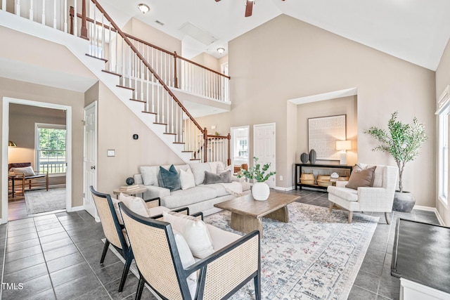 1717 Ormond Rd, Hurdle Mills, NC 27541 - living area with high vaulted ceiling, stairs, baseboards, and a ceiling fan