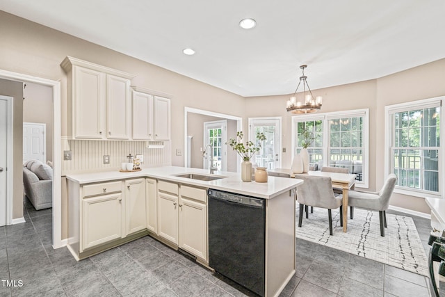 1717 Ormond Rd, Hurdle Mills, NC 27541 - kitchen with black dishwasher, a sink, a chandelier, healthy amount of natural light, and recessed lighting