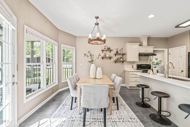1717 Ormond Rd, Hurdle Mills, NC 27541 - dining area featuring a chandelier, baseboards, recessed lighting, and dark tile patterned flooring