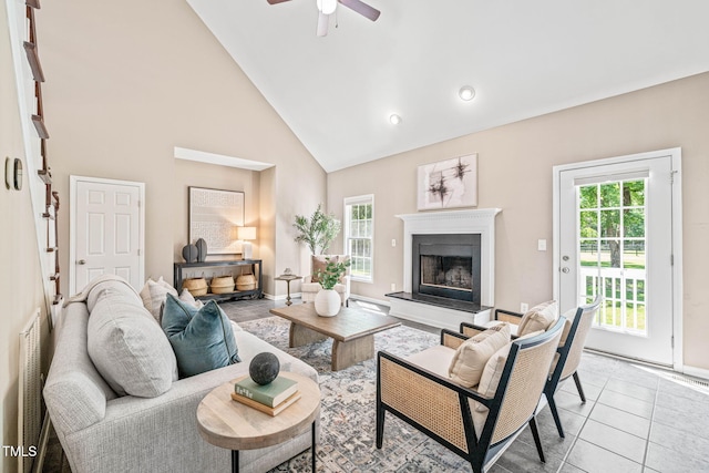 1717 Ormond Rd, Hurdle Mills, NC 27541 - living area with plenty of natural light, high vaulted ceiling, a fireplace with raised hearth, ceiling fan, and baseboards