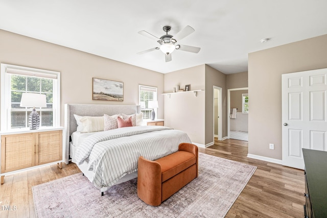 1717 Ormond Rd, Hurdle Mills, NC 27541 - bedroom with wood finished floors, multiple windows, baseboards, and a ceiling fan