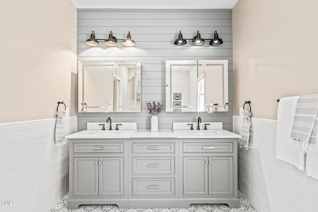 1717 Ormond Rd, Hurdle Mills, NC 27541 - bathroom with tile walls, double vanity, and a wainscoted wall