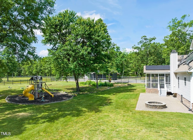 1717 Ormond Rd, Hurdle Mills, NC 27541 - view of yard with an outdoor fire pit, a sunroom, and a playground
