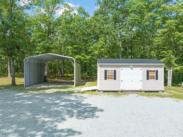 1717 Ormond Rd, Hurdle Mills, NC 27541 - garage with driveway and a detached carport