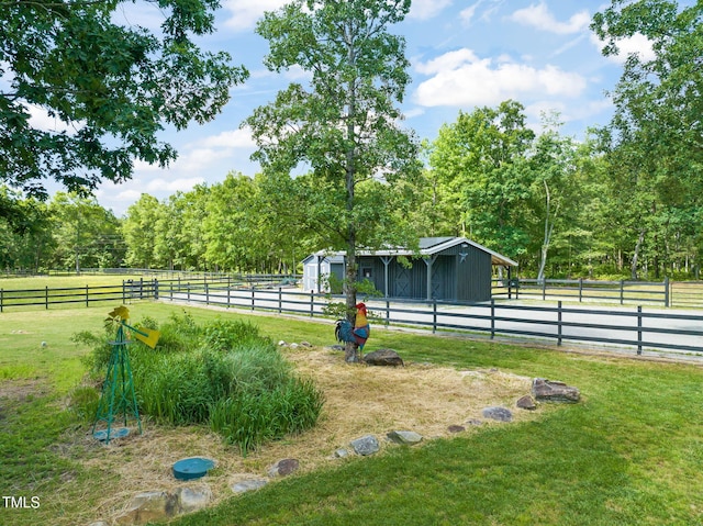 1717 Ormond Rd, Hurdle Mills, NC 27541 - view of yard featuring an exterior structure, an outdoor structure, and a view of rural / pastoral area