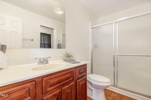 408 N Stewart St, Clayton, NC 27520 - full bath with vanity, wood finished floors, a shower with door, and toilet