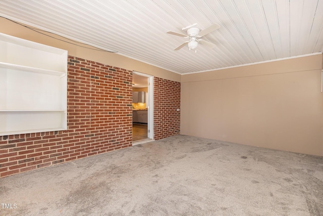408 N Stewart St, Clayton, NC 27520 - carpeted spare room featuring brick wall, ceiling fan, and wood ceiling