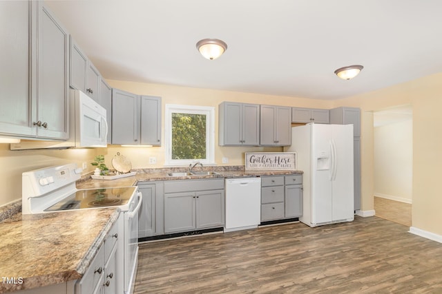408 N Stewart St, Clayton, NC 27520 - kitchen with white appliances, a sink, gray cabinetry, dark wood-type flooring, and baseboards
