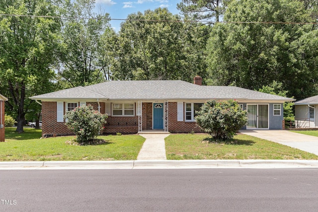 408 N Stewart St, Clayton, NC 27520 - ranch-style home featuring brick siding, a chimney, a front lawn, concrete driveway, and a shingled roof