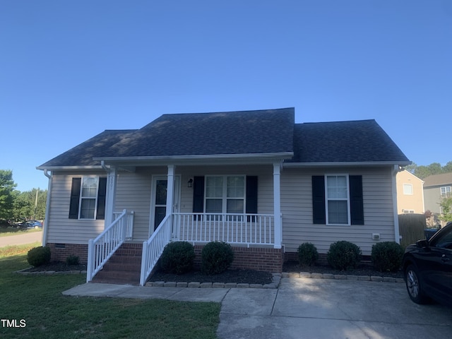 2001 Ballston Pl, Knightdale, NC 27545 - view of front facade with a porch, roof with shingles, and crawl space