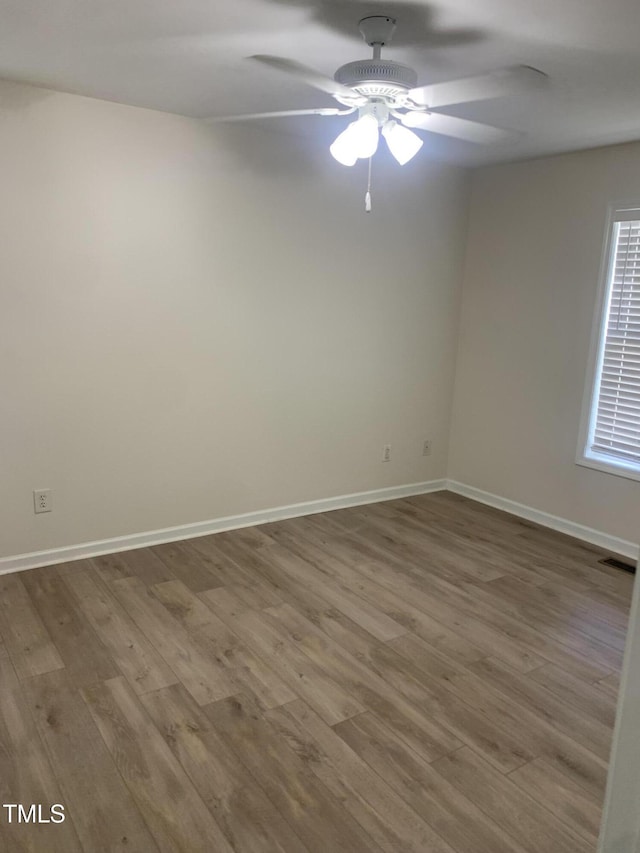 2001 Ballston Pl, Knightdale, NC 27545 - empty room featuring a ceiling fan, wood finished floors, and baseboards