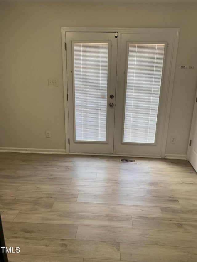 2001 Ballston Pl, Knightdale, NC 27545 - doorway to outside with french doors, wood finished floors, and baseboards