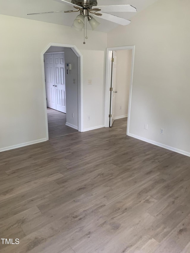2001 Ballston Pl, Knightdale, NC 27545 - spare room featuring ceiling fan, wood finished floors, baseboards, and arched walkways