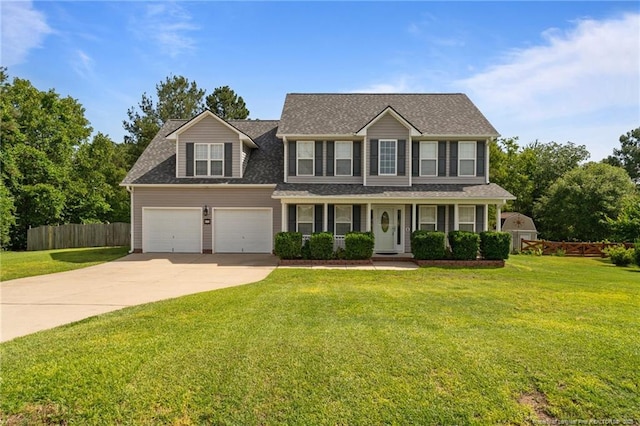 11 Checkmate Ct, Cameron, NC 28326 - colonial house featuring concrete driveway, covered porch, and roof with shingles