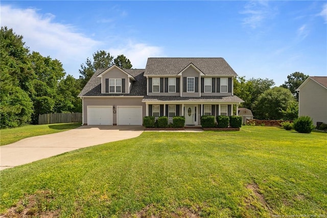 11 Checkmate Ct, Cameron, NC 28326 - view of front of house with driveway, a porch, a garage, and a shingled roof