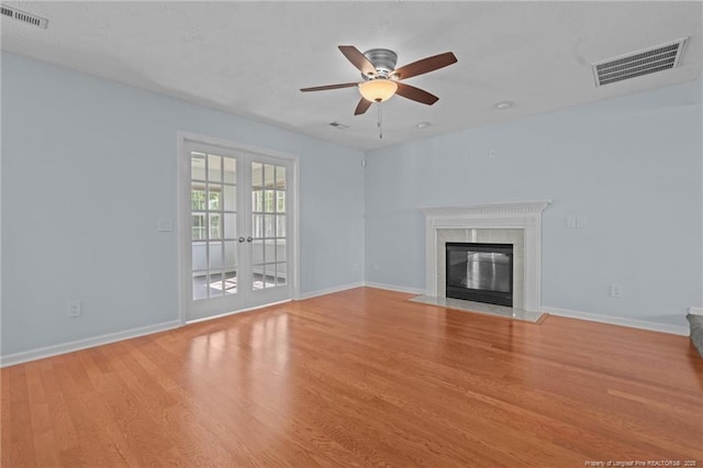 11 Checkmate Ct, Cameron, NC 28326 - unfurnished living room with a ceiling fan, french doors, light wood-style flooring, and baseboards