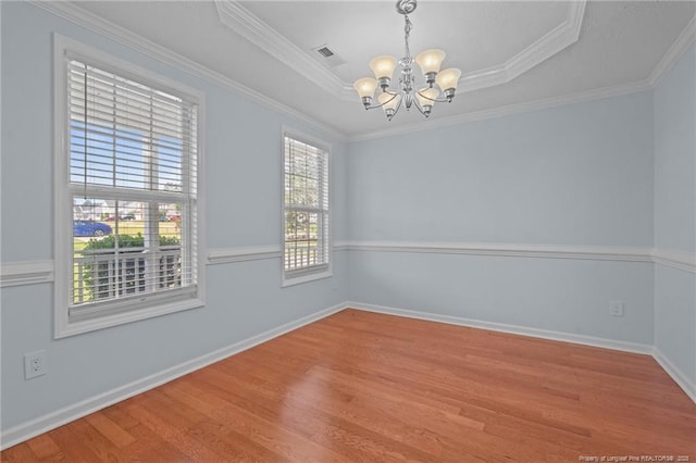 11 Checkmate Ct, Cameron, NC 28326 - unfurnished room with a chandelier, wood finished floors, a tray ceiling, baseboards, and ornamental molding