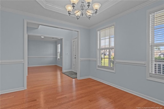 11 Checkmate Ct, Cameron, NC 28326 - unfurnished room featuring a chandelier, wood finished floors, plenty of natural light, baseboards, and crown molding