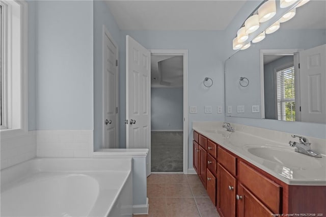 11 Checkmate Ct, Cameron, NC 28326 - full bathroom with tile patterned flooring, a garden tub, double vanity, and baseboards