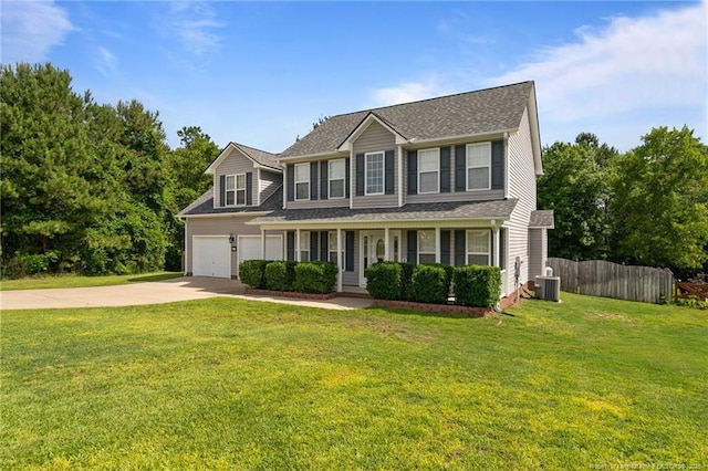11 Checkmate Ct, Cameron, NC 28326 - view of front of house with driveway, covered porch, a garage, central AC unit, and a shingled roof
