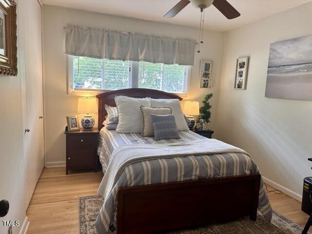 3620 Arrowwood Dr, Raleigh, NC 27604 - bedroom featuring light wood-style flooring, baseboards, and ceiling fan