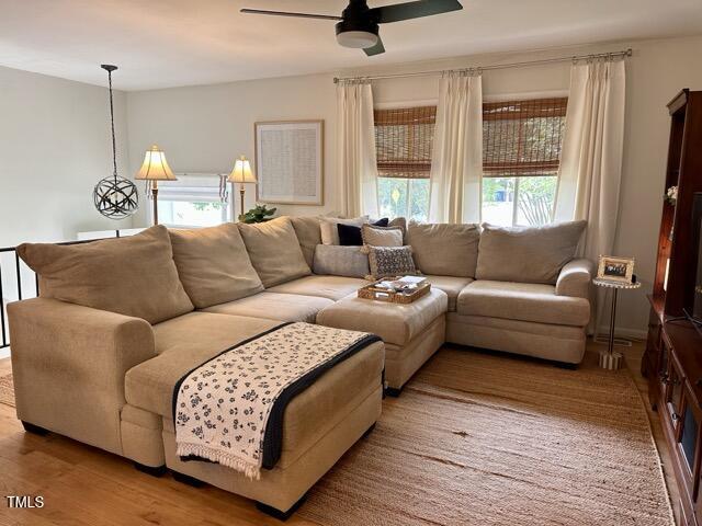 3620 Arrowwood Dr, Raleigh, NC 27604 - living area featuring ceiling fan, plenty of natural light, and wood finished floors