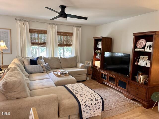 3620 Arrowwood Dr, Raleigh, NC 27604 - living room with ceiling fan and light wood finished floors