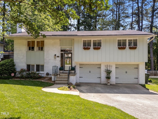 3620 Arrowwood Dr, Raleigh, NC 27604 - bi-level home with brick siding, a garage, a front yard, and driveway