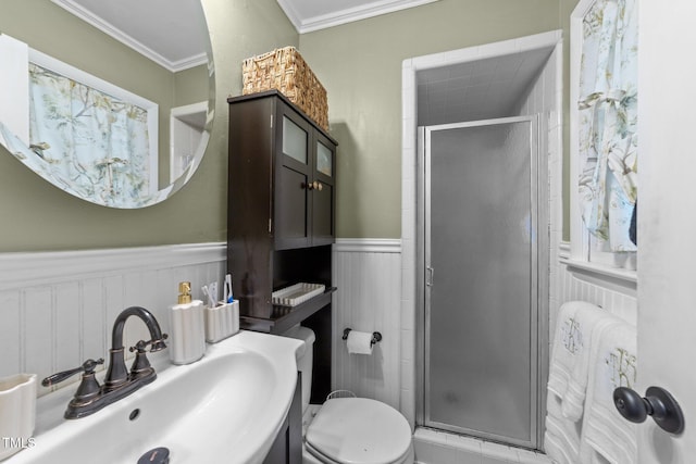 3620 Arrowwood Dr, Raleigh, NC 27604 - full bath with a sink, a shower stall, a wainscoted wall, ornamental molding, and toilet