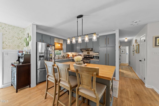 3620 Arrowwood Dr, Raleigh, NC 27604 - dining area with light wood finished floors and wallpapered walls