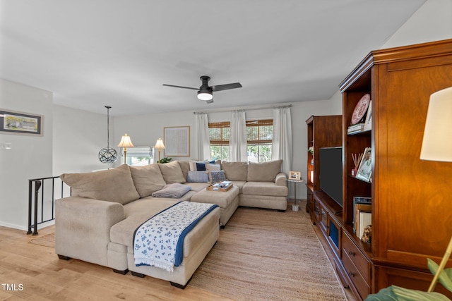 3620 Arrowwood Dr, Raleigh, NC 27604 - living area with ceiling fan, light wood-style floors, and baseboards