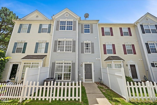 8630 Neuse Lndg Unit 105, Raleigh, NC 27616 - townhome / multi-family property with a fenced front yard
