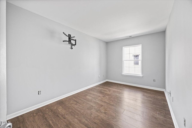 8630 Neuse Lndg Unit 105, Raleigh, NC 27616 - empty room with dark wood-style floors and baseboards