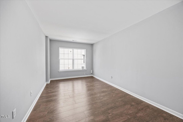 8630 Neuse Lndg Unit 105, Raleigh, NC 27616 - spare room with dark wood-type flooring and baseboards