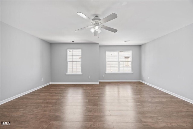8630 Neuse Lndg Unit 105, Raleigh, NC 27616 - empty room featuring ceiling fan, dark wood-type flooring, and baseboards